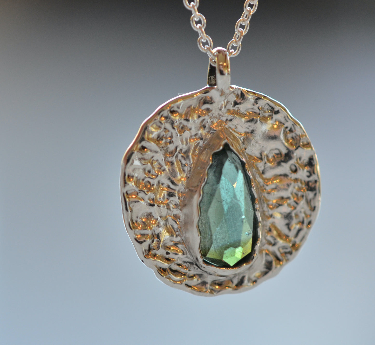 teal green tourmaline medallion