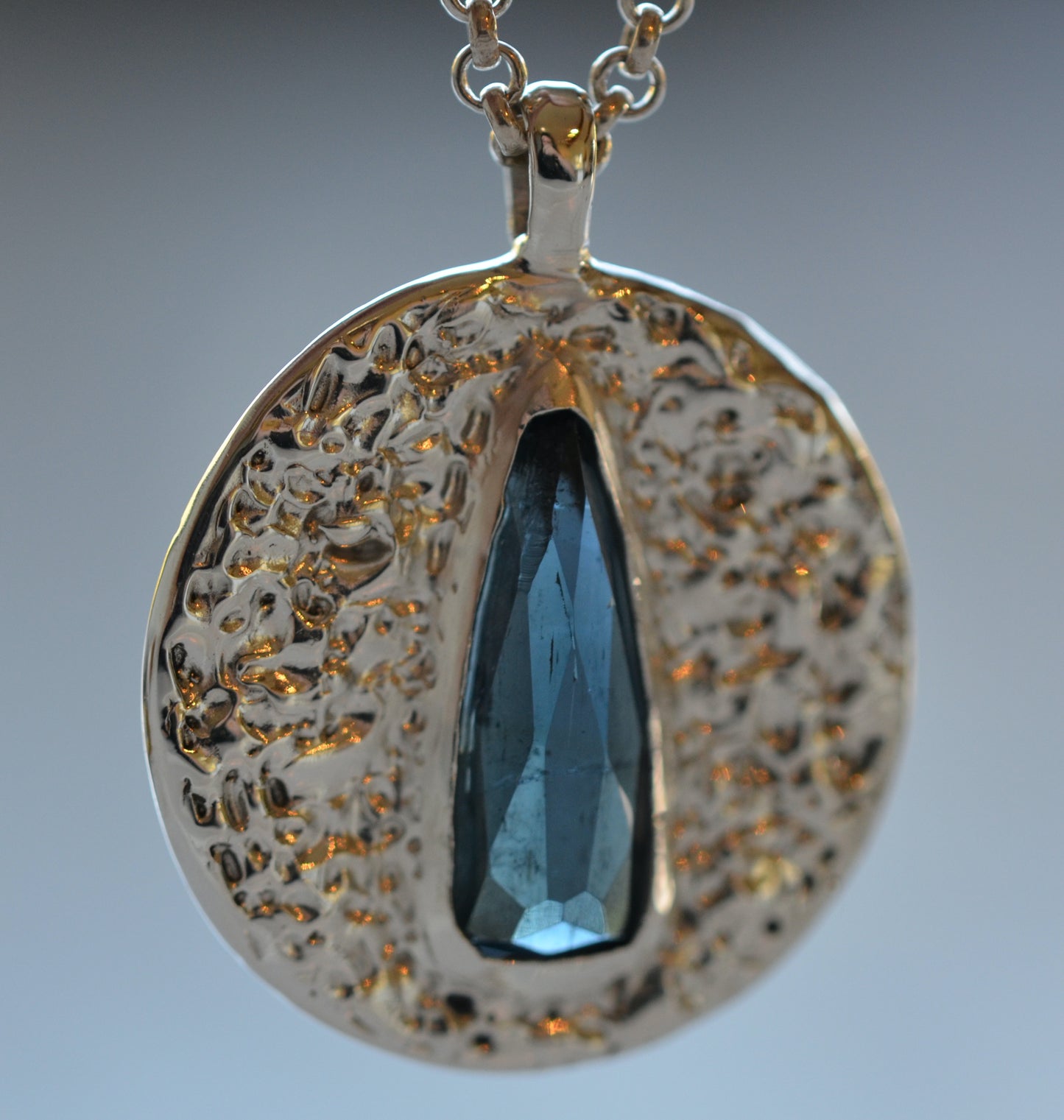 dark blue elongated pear medallion