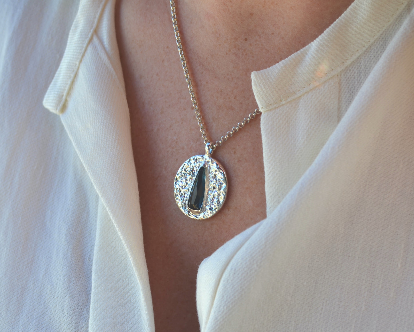 dark blue elongated pear medallion