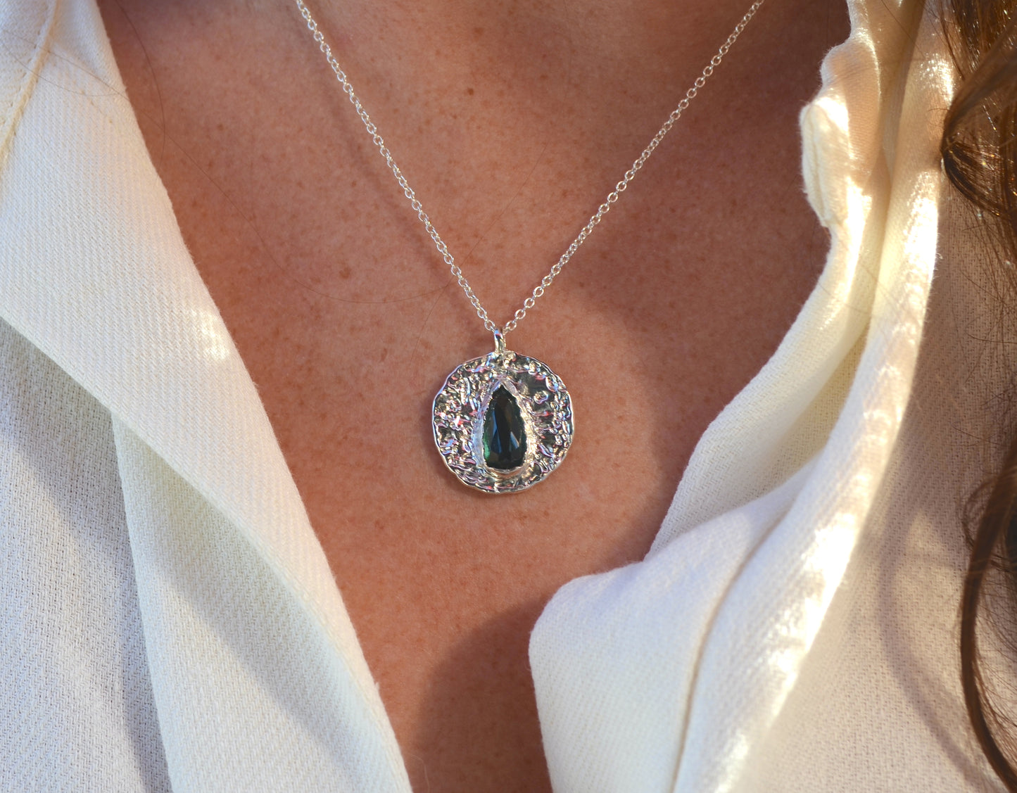 teal green tourmaline medallion